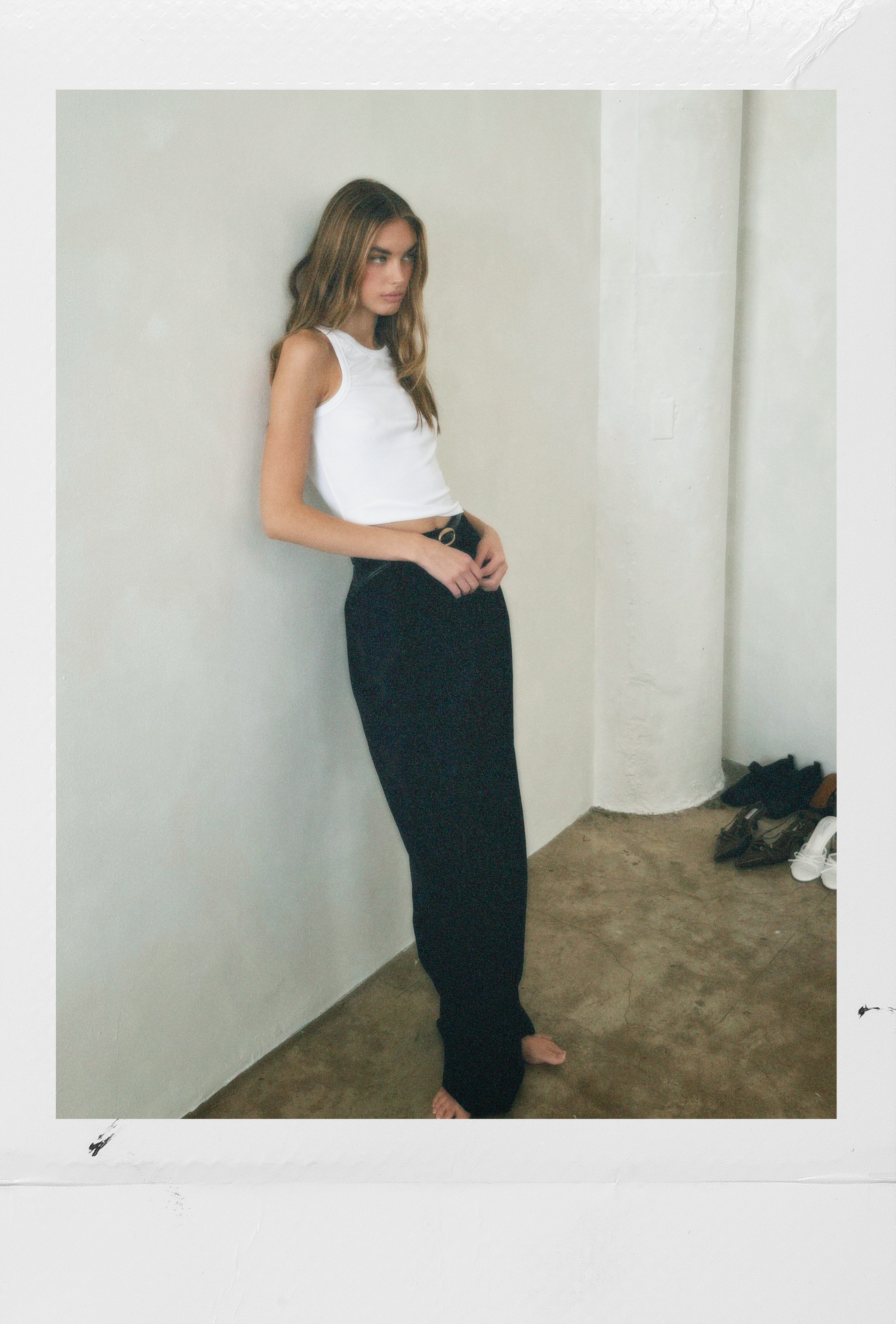 Black tailored trouser styled with a white tank for an elevated everyday look