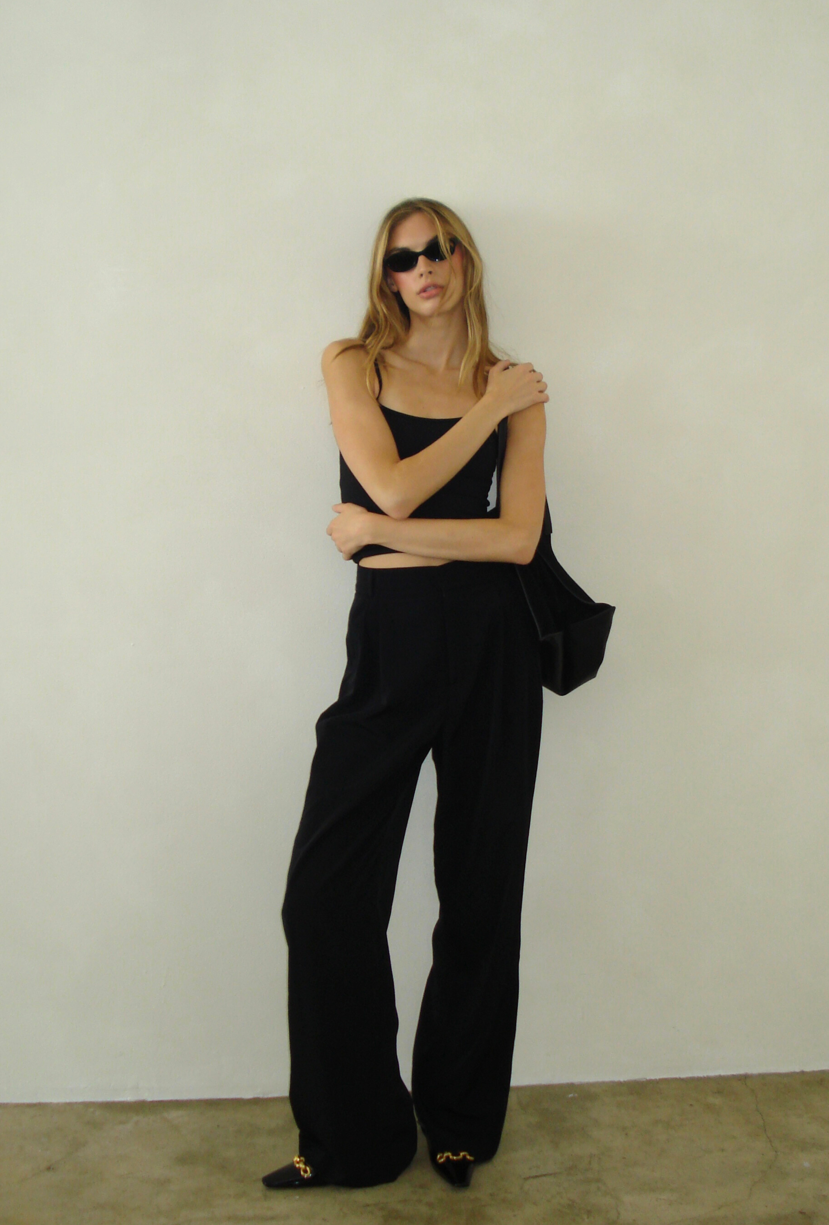 Tailored trouser worn with a black tank for a casual everyday look