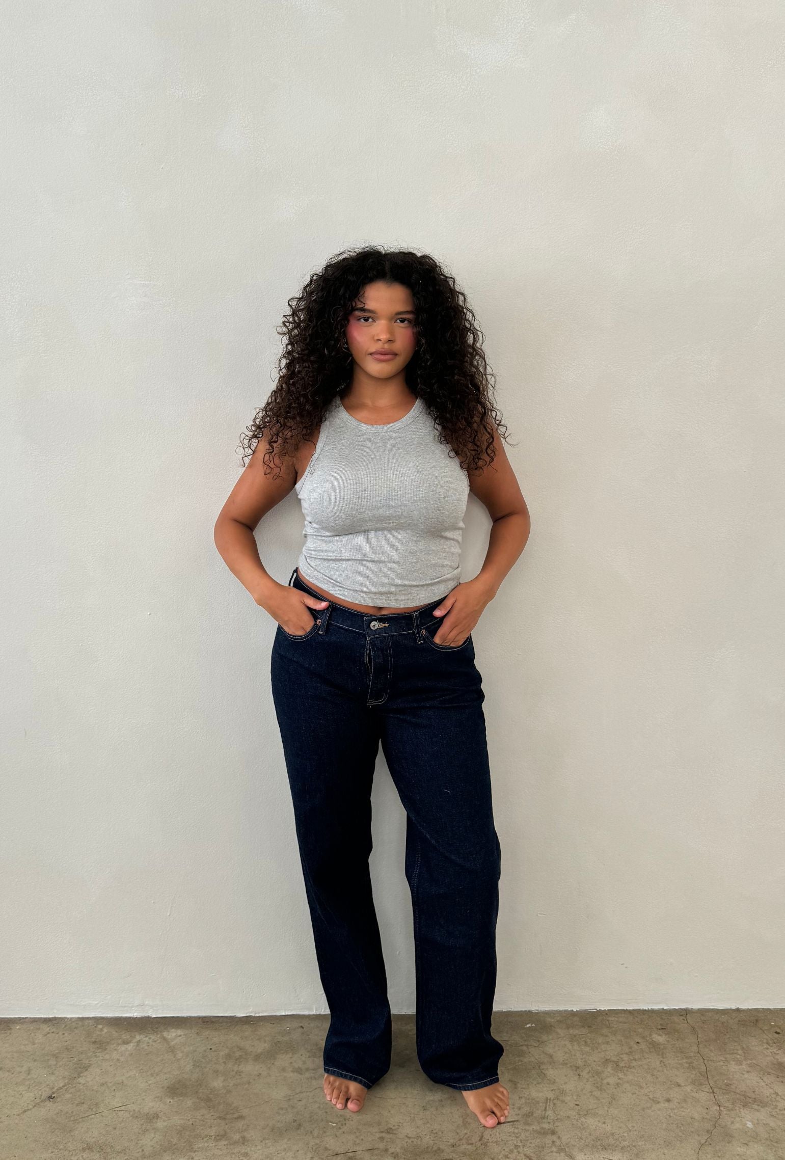 Gray cropped high neck tank styled with dark denim