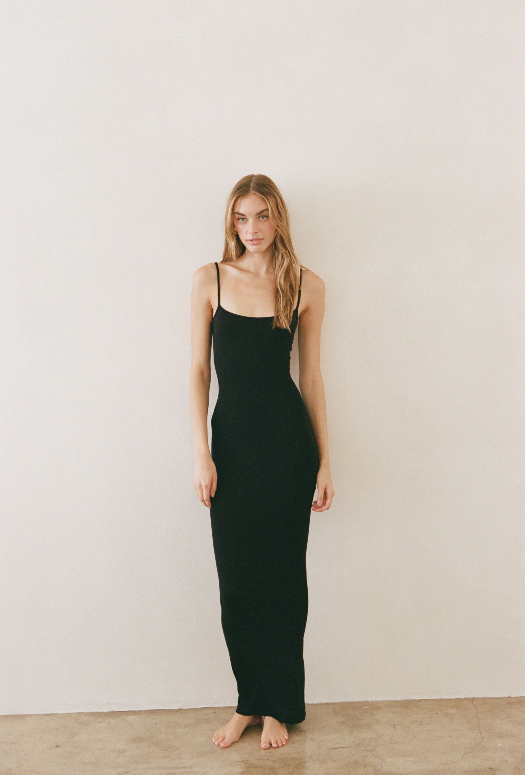 Black minimalist maxi dress designed with a streamlined silhouette