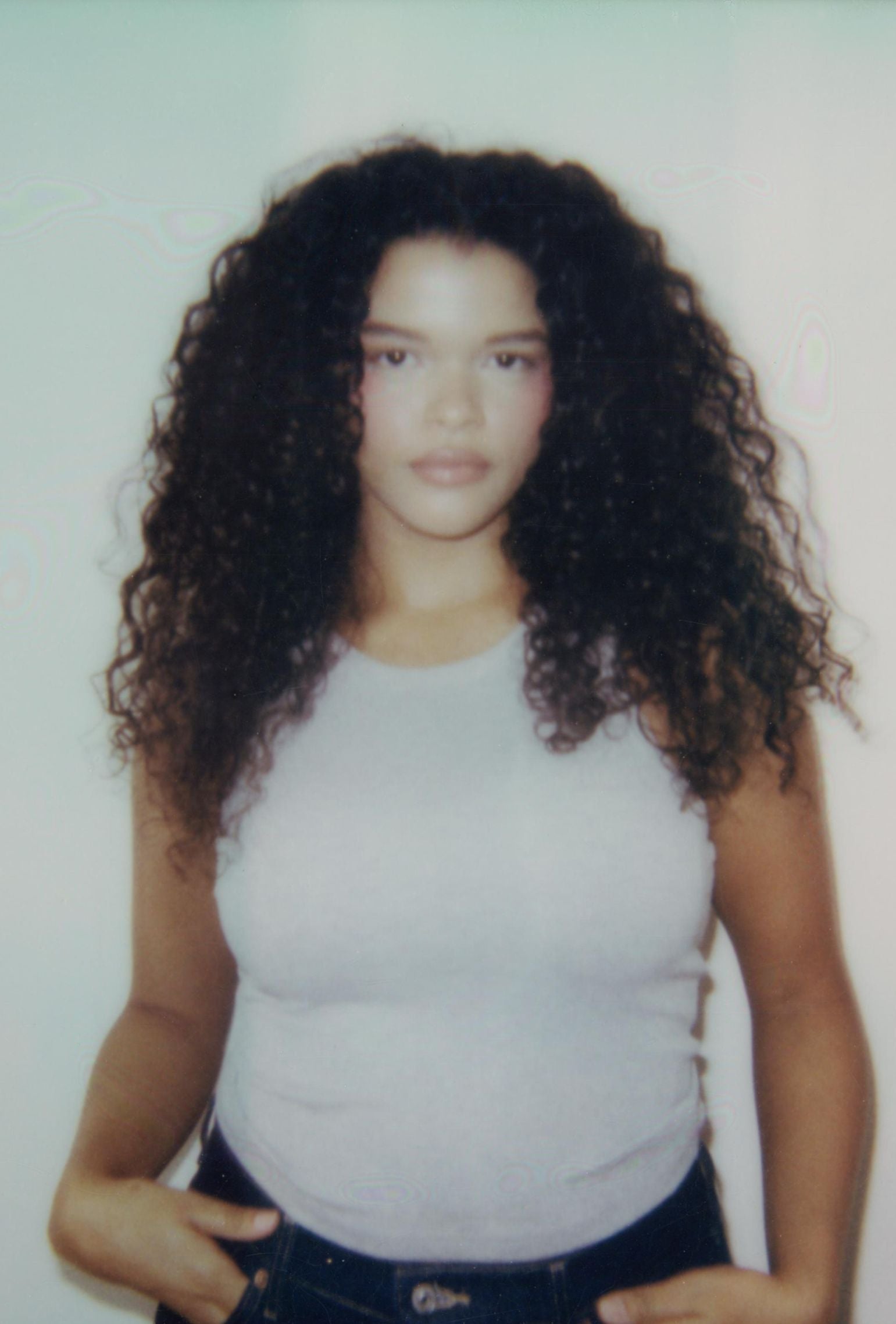 Gray cropped high neck tank styled with denim