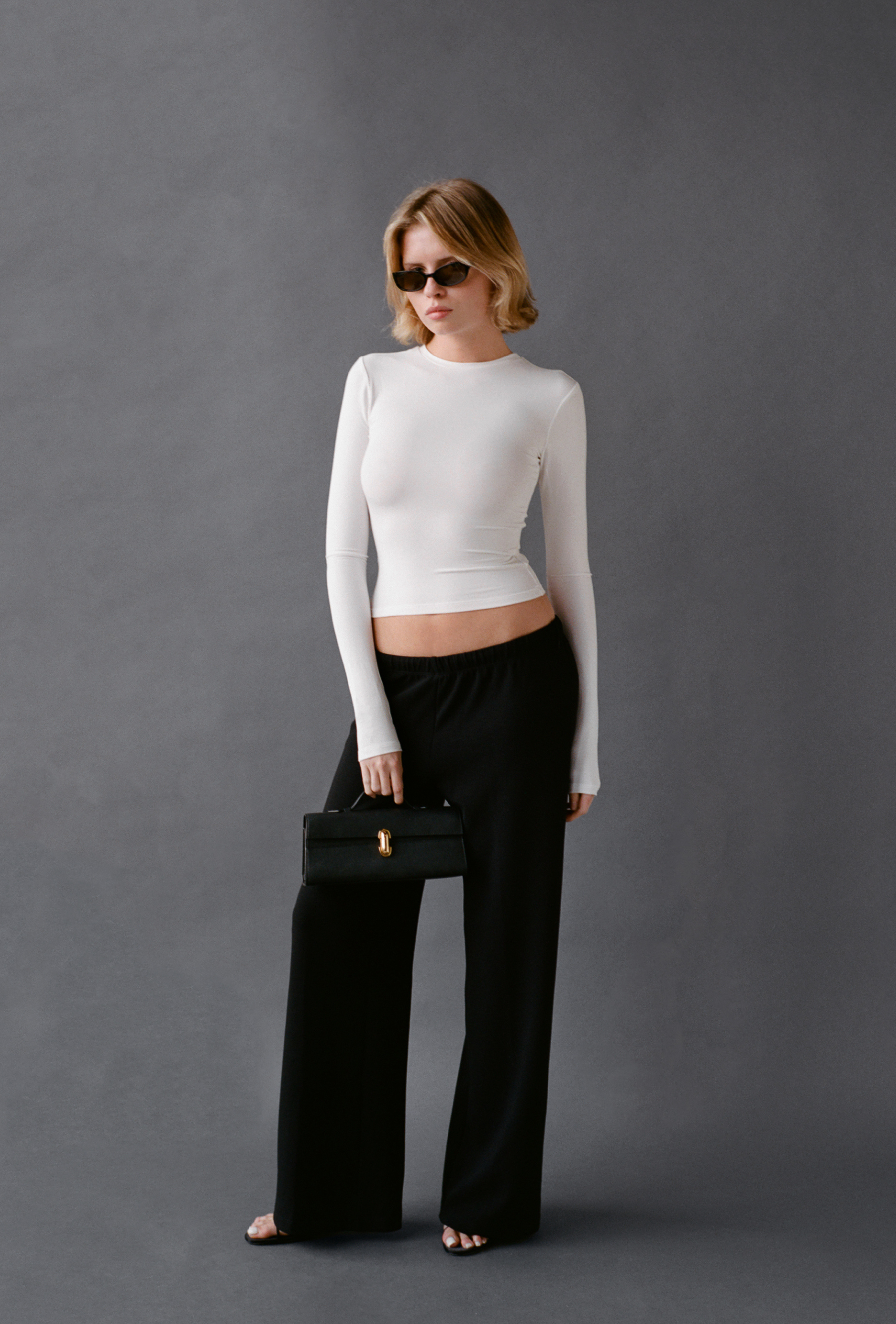 LAUD long sleeve tee in white styled with black pants and sunglasses