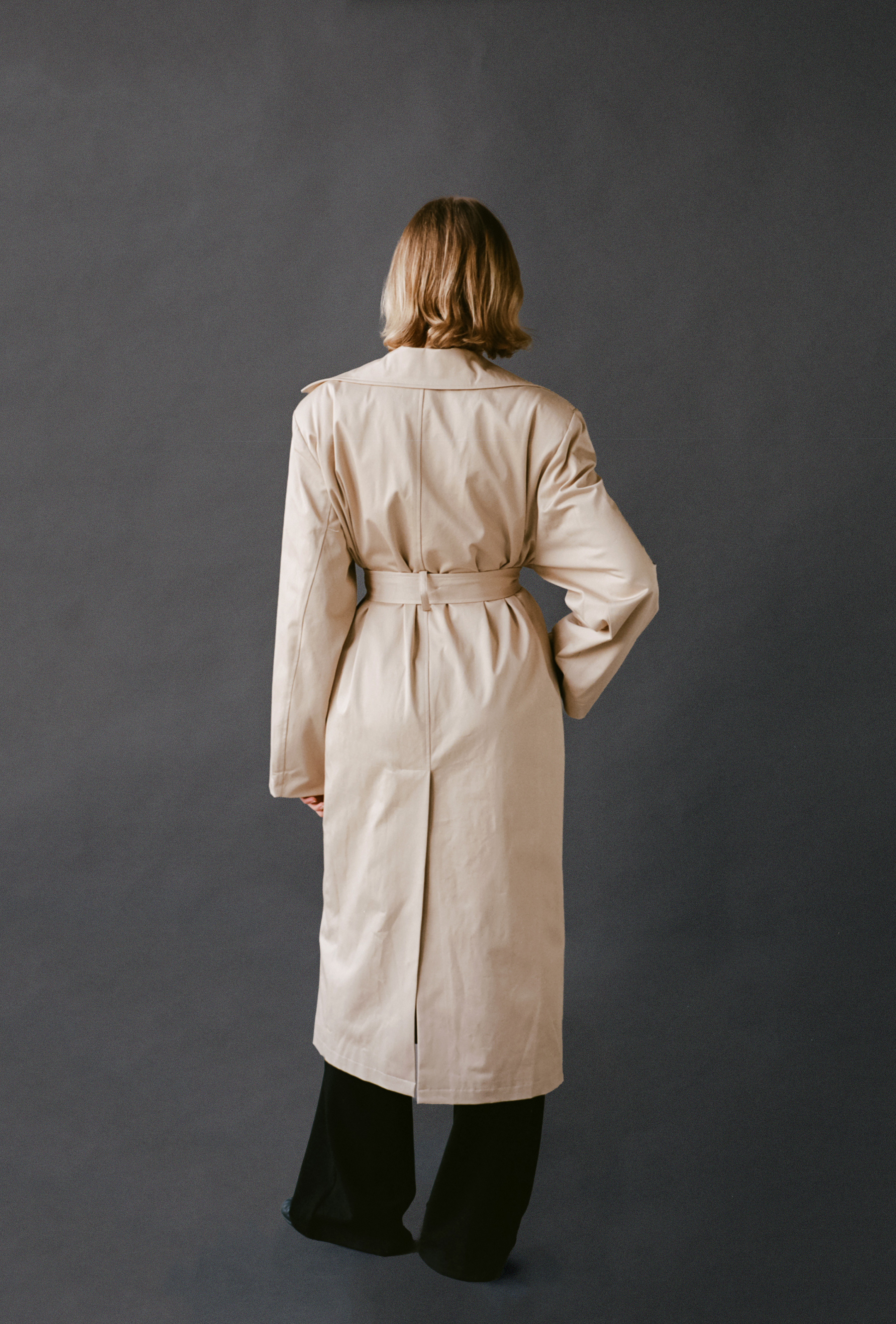 LAUD trench coat back view styled with black pants
