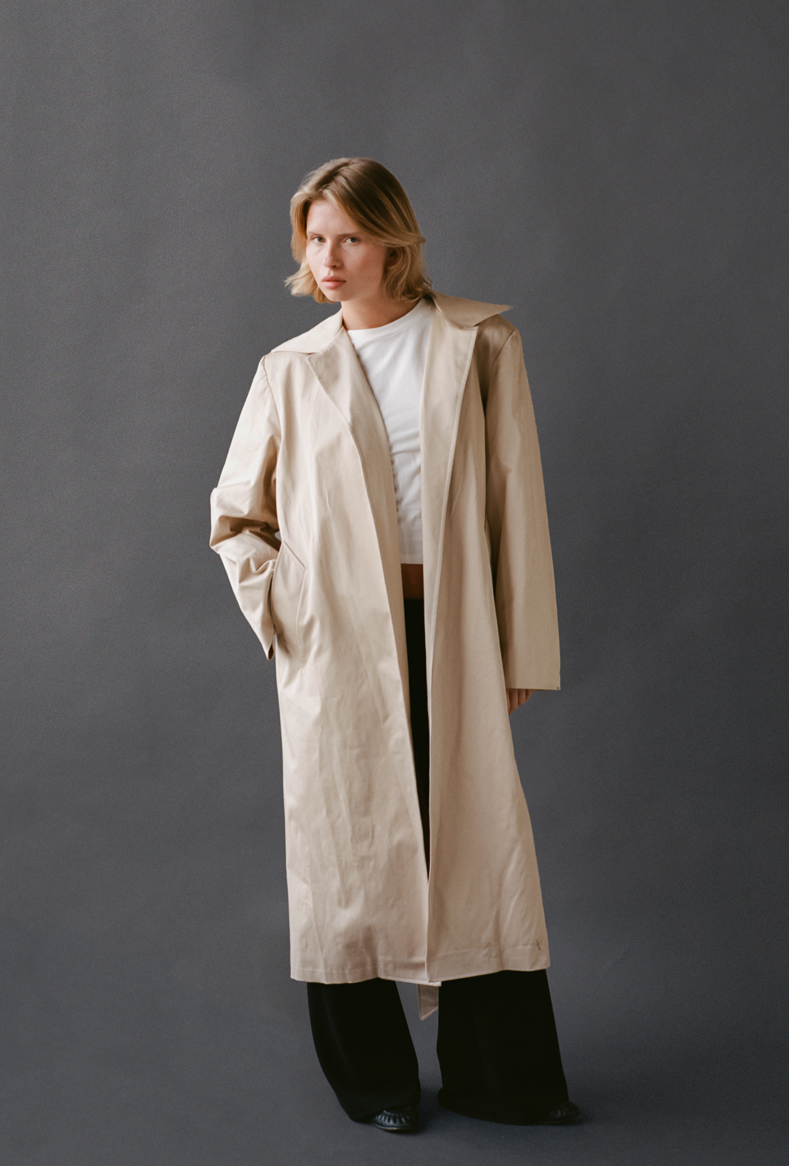 LAUD trench coat open styled with white tee and black pants
